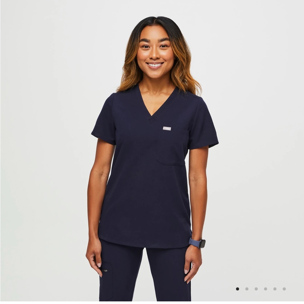 Catarina One-Pocket Scrub Top Navy in sizes XS and XXS available.